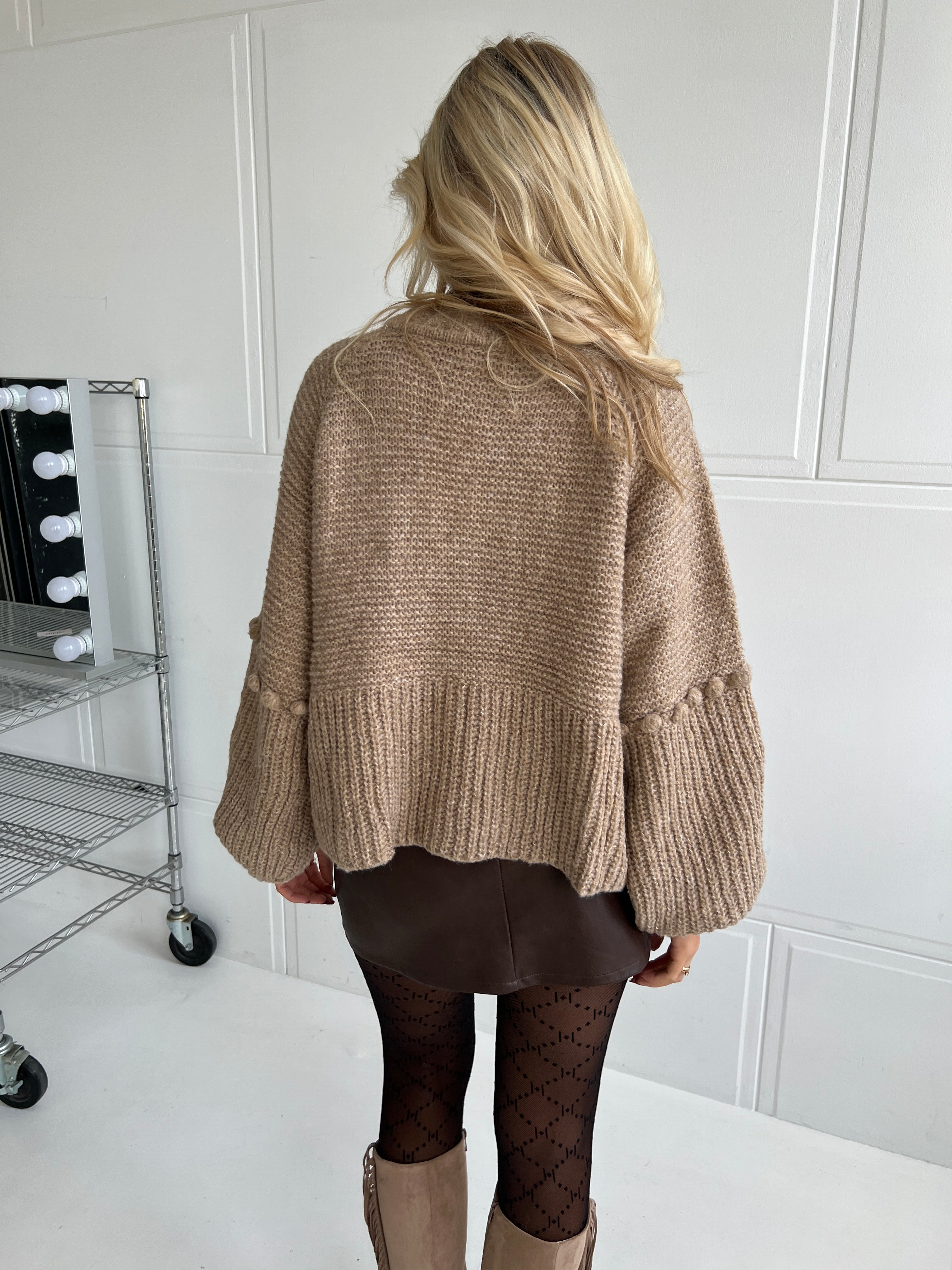 Chunky knit cardigan with pom-poms