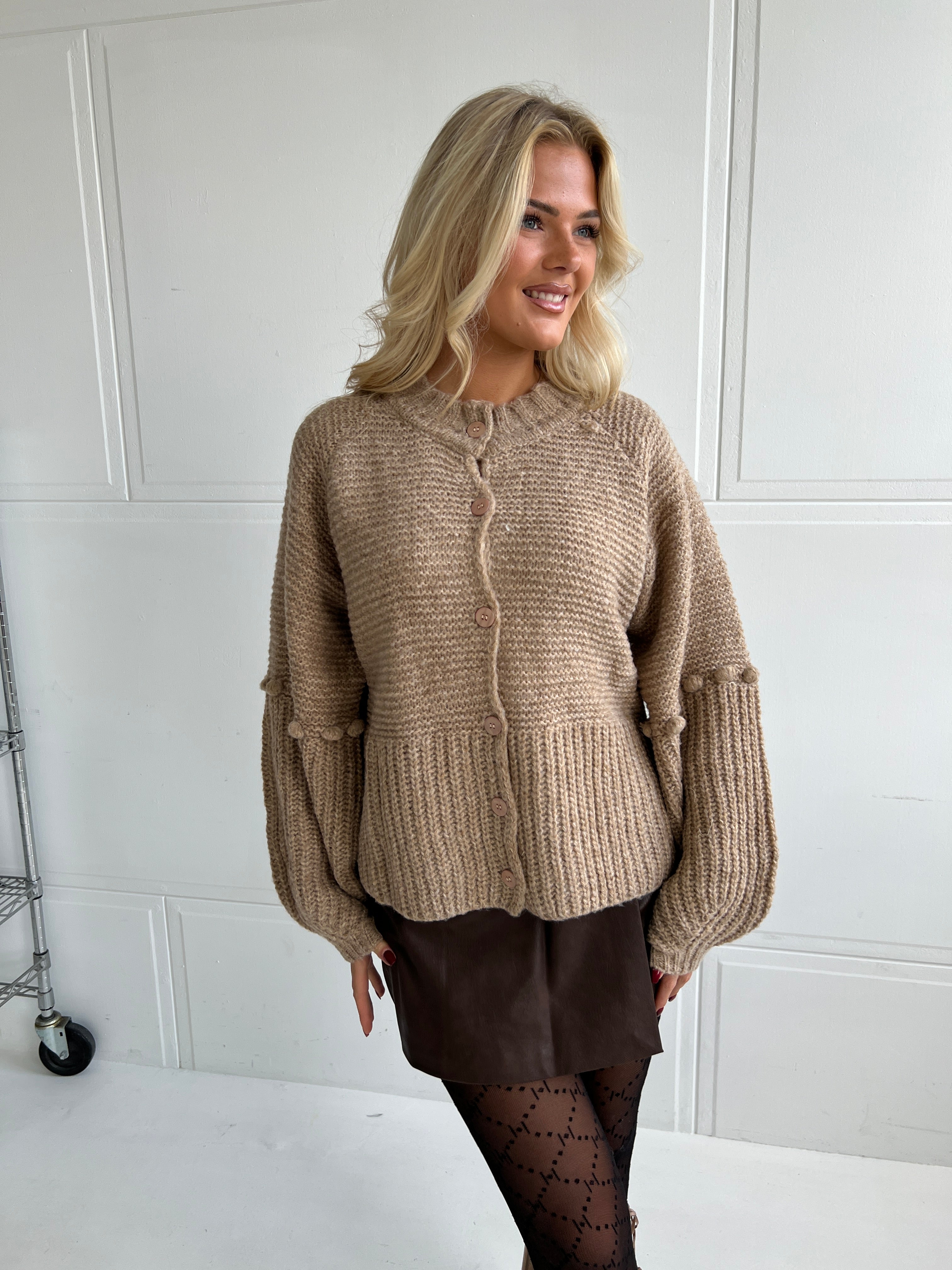 Chunky knit cardigan with pom-poms