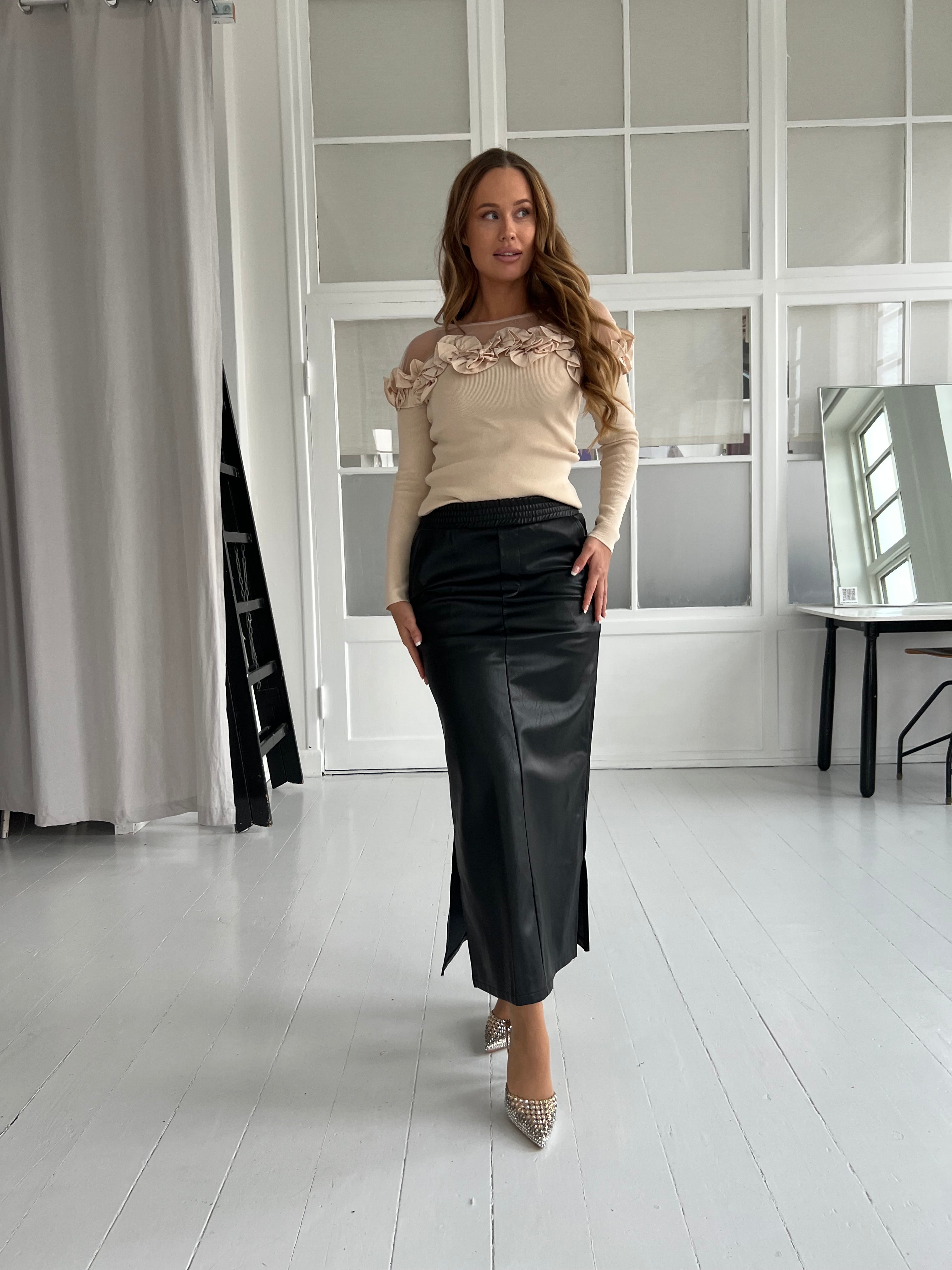 Its may black skirt